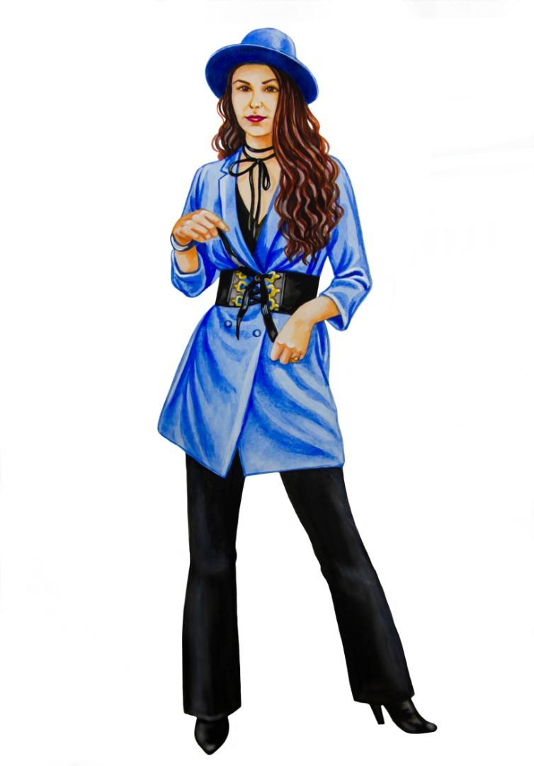 Girl dressed in a blue coat and black trousers and a hat on her head.jpg